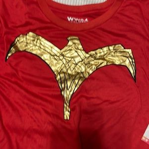 Wonder Woman T-shirt. With button on cape. Never worn